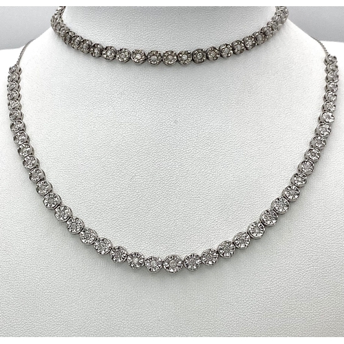 18 - A White Gold Diamond Necklace and Tennis Bracelet. Necklace - 10k white gold with slightly graduated... 