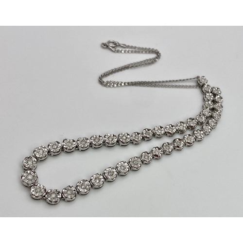 18 - A White Gold Diamond Necklace and Tennis Bracelet. Necklace - 10k white gold with slightly graduated... 