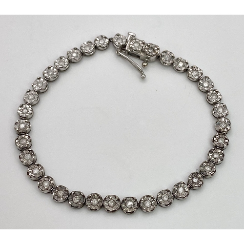 18 - A White Gold Diamond Necklace and Tennis Bracelet. Necklace - 10k white gold with slightly graduated... 