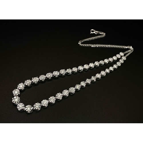 18 - A White Gold Diamond Necklace and Tennis Bracelet. Necklace - 10k white gold with slightly graduated... 