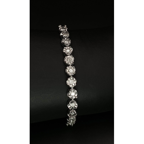 18 - A White Gold Diamond Necklace and Tennis Bracelet. Necklace - 10k white gold with slightly graduated... 