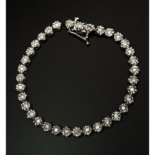 18 - A White Gold Diamond Necklace and Tennis Bracelet. Necklace - 10k white gold with slightly graduated... 