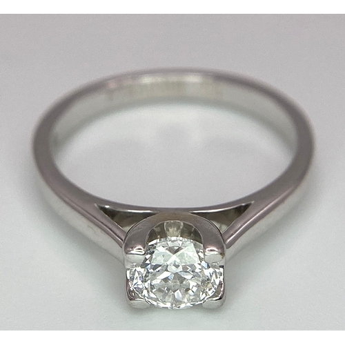 197 - An 18K White Gold Diamond Solitaire Ring. A 0.58ct brilliant round cut diamond. Size K. 3.15g total ... 