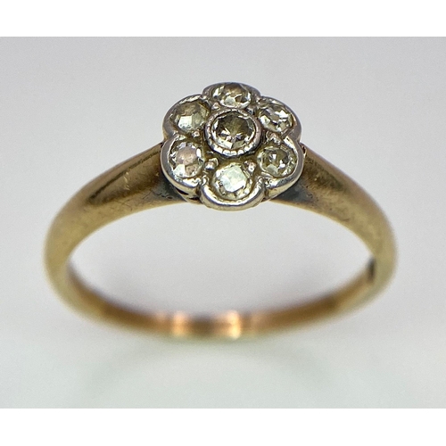 320 - An 18K Yellow Gold Diamond Cluster Floral Ring. Size L. 2.5g total weight.