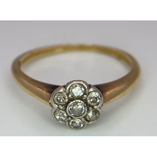 320 - An 18K Yellow Gold Diamond Cluster Floral Ring. Size L. 2.5g total weight.