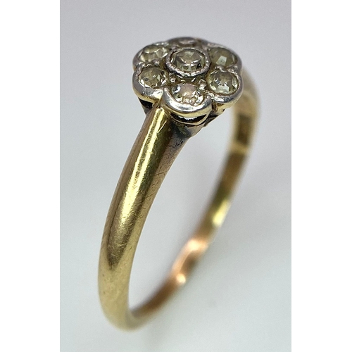 320 - An 18K Yellow Gold Diamond Cluster Floral Ring. Size L. 2.5g total weight.