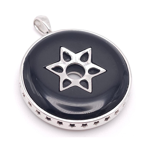 347 - An 18K White Gold Black Onyx and Encrusted Diamond Star Pendant. Rich black onyx with two different ... 