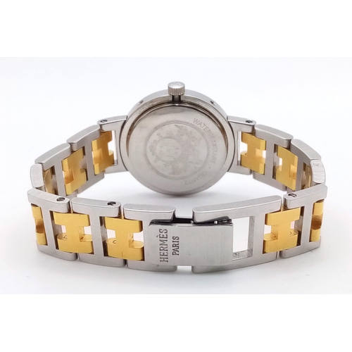 403 - A Designer Hermes Quartz Ladies Watch. Two tone stainless steel bracelet and case - 25m. White dial ... 