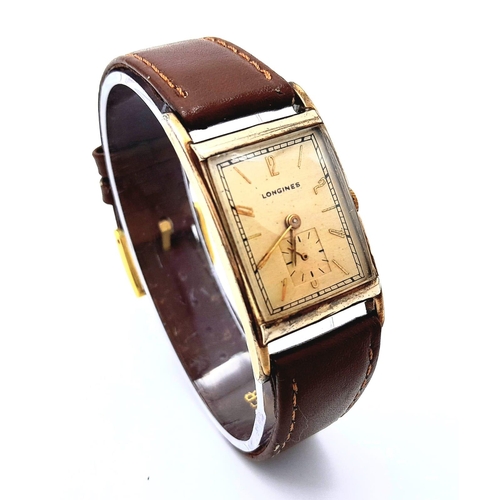 438 - A Vintage Mechanical Longine Gents Watch. Brown leather strap. Gold filled tank case - 23mm. Gold to... 