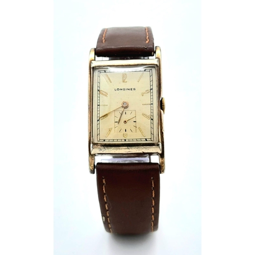 438 - A Vintage Mechanical Longine Gents Watch. Brown leather strap. Gold filled tank case - 23mm. Gold to... 