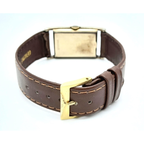 438 - A Vintage Mechanical Longine Gents Watch. Brown leather strap. Gold filled tank case - 23mm. Gold to... 