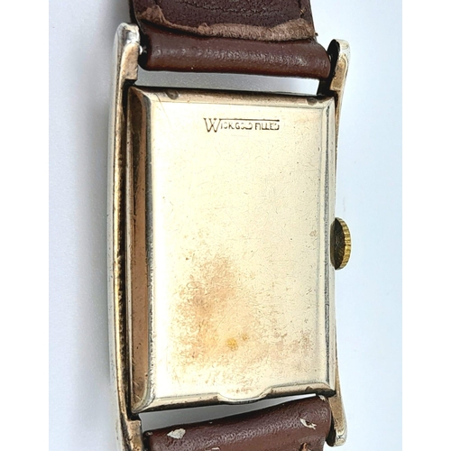 438 - A Vintage Mechanical Longine Gents Watch. Brown leather strap. Gold filled tank case - 23mm. Gold to... 