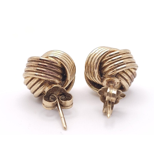 543 - A Pair of 9k Yellow Gold Knot Stud Earrings. 3.8g total weight. Ref: 16469