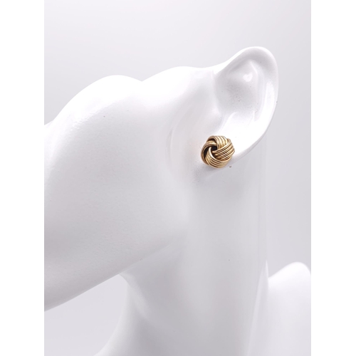 543 - A Pair of 9k Yellow Gold Knot Stud Earrings. 3.8g total weight. Ref: 16469