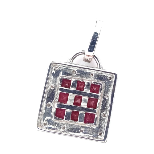 288 - An 18 K white gold, diamond and ruby set, square pendant, weight: 2.4 g.