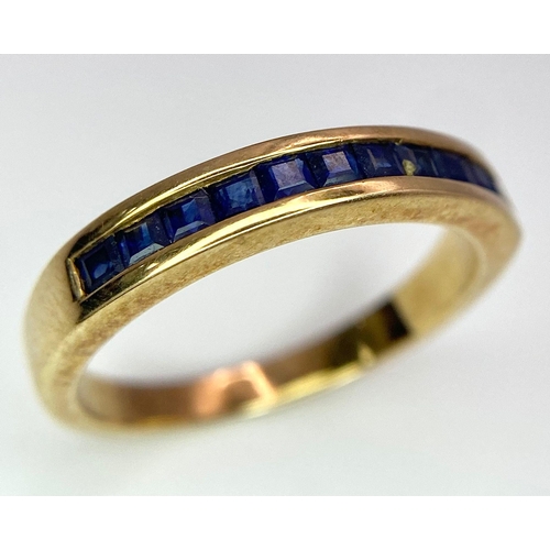 348 - 9K YELLOW GOLD SAPPHIRE CHANNEL SET BAND RING, WEIGHT 2.6G, SIZE M 1/2