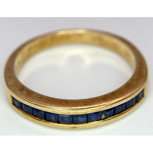 348 - 9K YELLOW GOLD SAPPHIRE CHANNEL SET BAND RING, WEIGHT 2.6G, SIZE M 1/2