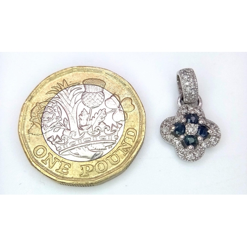 389 - A 14K White Gold Sapphire and Diamond Small Clover Pendant. 2cm. 1.46g total weight.