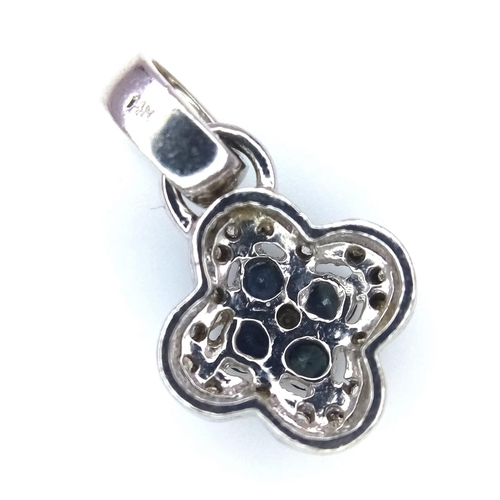 389 - A 14K White Gold Sapphire and Diamond Small Clover Pendant. 2cm. 1.46g total weight.