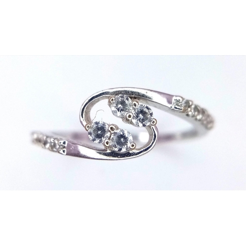 443 - An 18 K white gold ring with cubic zirconia, size: K1/2, weight: 1.6 g.