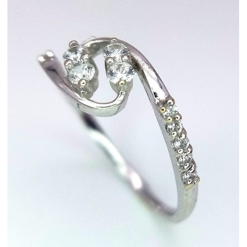 443 - An 18 K white gold ring with cubic zirconia, size: K1/2, weight: 1.6 g.