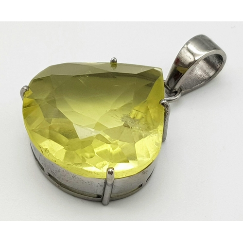 512 - A Lemon Quartz Teardrop Pendant set in 925 Sterling silver. 30.9ct. 11.20g. 4cm. Comes with a presen... 