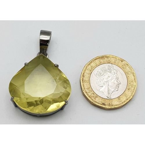 512 - A Lemon Quartz Teardrop Pendant set in 925 Sterling silver. 30.9ct. 11.20g. 4cm. Comes with a presen... 