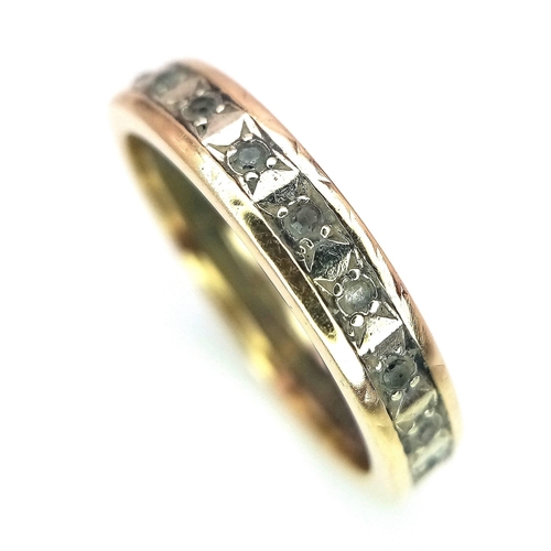 516 - A 9 K yellow gold eternity ring with cubic zirconia, size: N, weight: 2.4