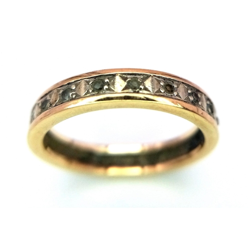 516 - A 9 K yellow gold eternity ring with cubic zirconia, size: N, weight: 2.4