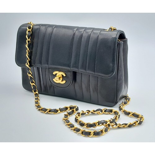 1 - An Early 1990s Chanel Mademoiselle Classic Flap Chain Bag. Black lambskin leather. Gold plated hardw... 