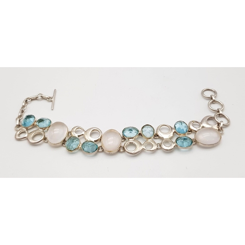 500 - A Rose Quartz & Blue Topaz Silver Bracelet. 42ctw. W- 29.20g. 19cm length. Ref: HV 2015