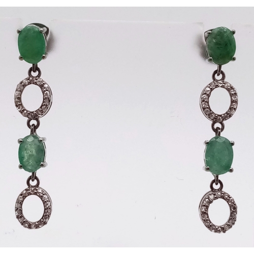 521 - A Pair of Zambian Emerald & Diamond Silver Drop Earrings. Emerald -2.68ctw. Diamond- 0.60ctw. 4cm dr... 