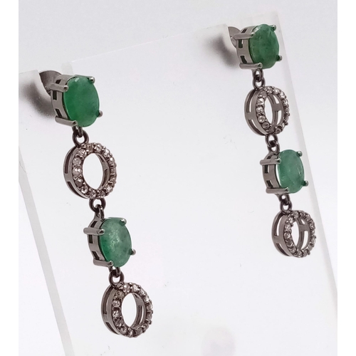 521 - A Pair of Zambian Emerald & Diamond Silver Drop Earrings. Emerald -2.68ctw. Diamond- 0.60ctw. 4cm dr... 