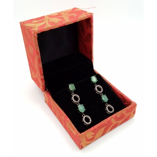 521 - A Pair of Zambian Emerald & Diamond Silver Drop Earrings. Emerald -2.68ctw. Diamond- 0.60ctw. 4cm dr... 