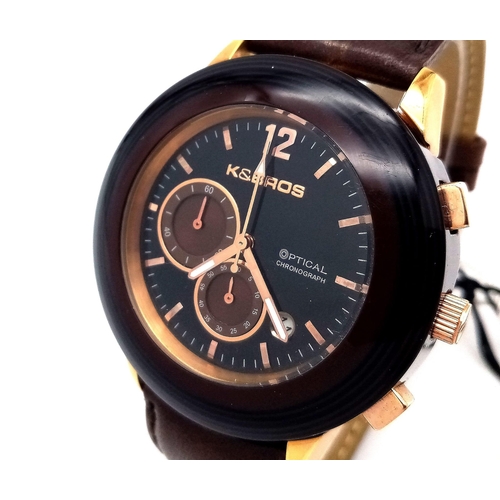 549 - A K & Bros Gents Quartz Chronograph Watch. Brown Leather strap. Ceramic case - 44mm. Black dial with... 