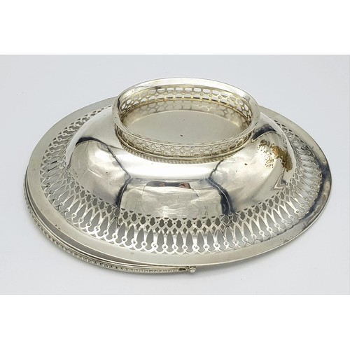 65 - An Antique Sterling Silver Oval Swing Handled Cake/Bread Basket. Pierced geometric and beaded decora... 