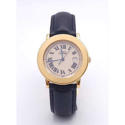 410 - A Must De Cartier Gold Plated Silver Quartz Ladies Watch. Black leather strap. Gold plated silver ca... 