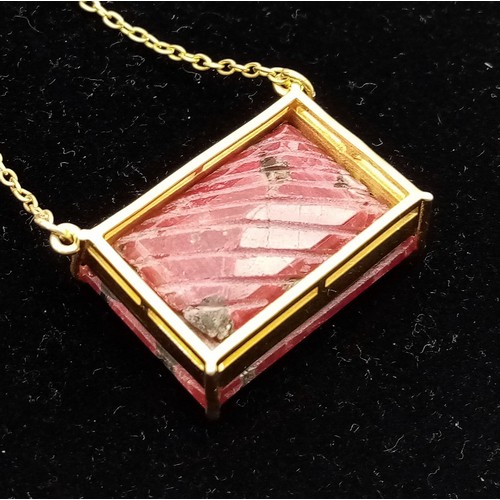 223 - A Carved African Ruby Pendant on a Gold Plated 925 Silver Necklace. Rectangular step cut. 52.20ct W-... 