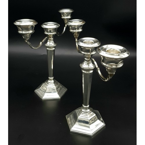 23 - A PAIR OF SILVER CANDELABRA EACH HOLDING 3 CANDLES IN CLASSIC STYLE AND HALLMARKED IN BIRMINGHAM 196... 