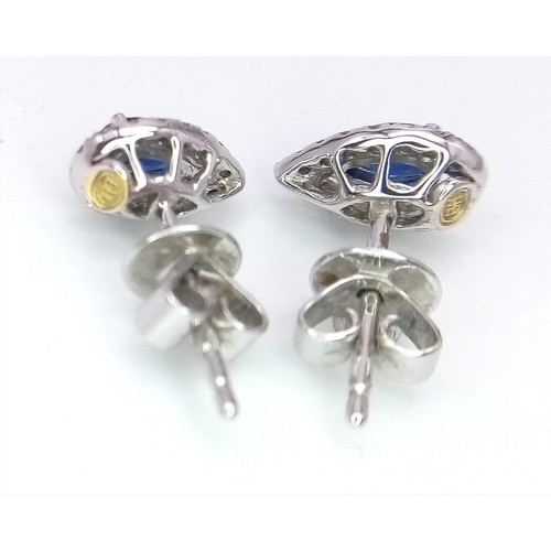 299 - A Pair of 18K White Gold, Diamond and Sapphire Cluster Rings - In a Pear Shape. 1.7g total weight.