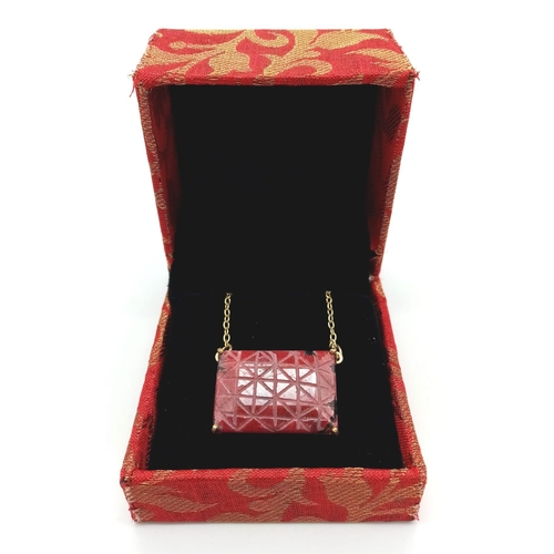 223 - A Carved African Ruby Pendant on a Gold Plated 925 Silver Necklace. Rectangular step cut. 52.20ct W-... 