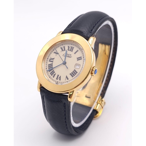 410 - A Must De Cartier Gold Plated Silver Quartz Ladies Watch. Black leather strap. Gold plated silver ca... 