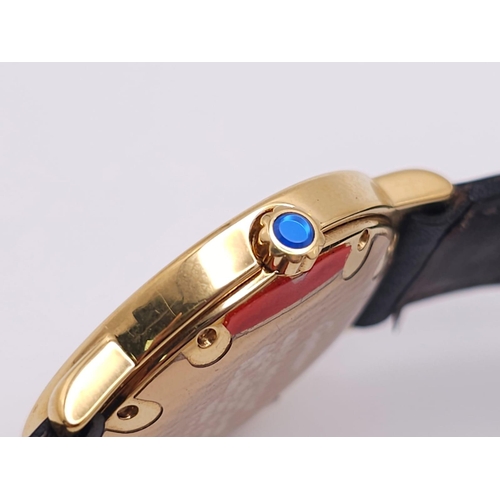 410 - A Must De Cartier Gold Plated Silver Quartz Ladies Watch. Black leather strap. Gold plated silver ca... 