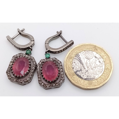 607 - A Pair of Madagascan Ruby and Diamond Earrings with Zambian Emeralds set in 925 Sterling silver. 7.2... 