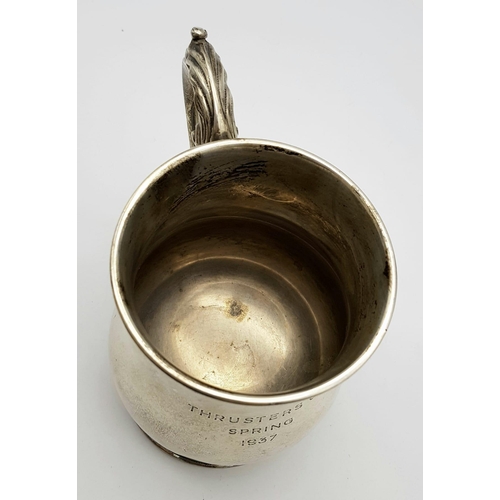 72 - A Sterling Silver Tankard Given to the Thrusters! Hourglass design with an ornate handle. Hallmarks ... 