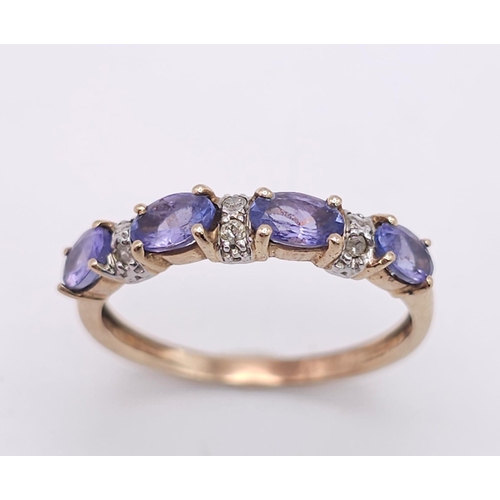 908 - A PRETTY 9K YELLOW GOLD DIAMOND & IOLITE  RING, WEIGHT 1.7G SIZE P