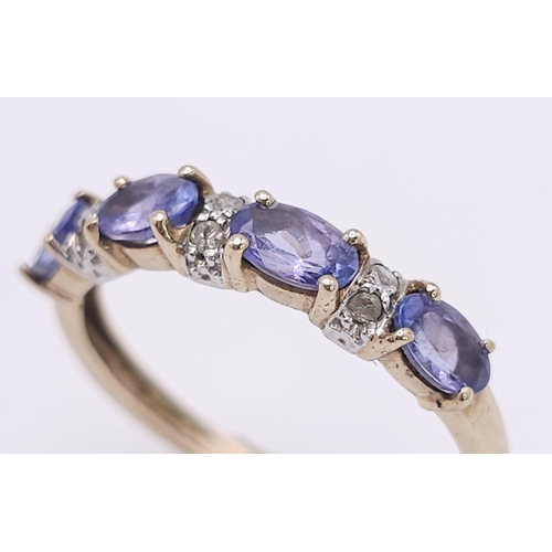 908 - A PRETTY 9K YELLOW GOLD DIAMOND & IOLITE  RING, WEIGHT 1.7G SIZE P