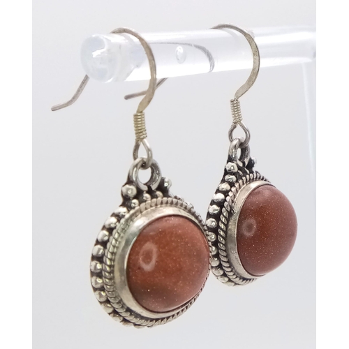 600 - A Pair of Sunstone Earrings Set in 925 Sterling silver. 14ct. W-7g. Comes with a presentation case. ... 