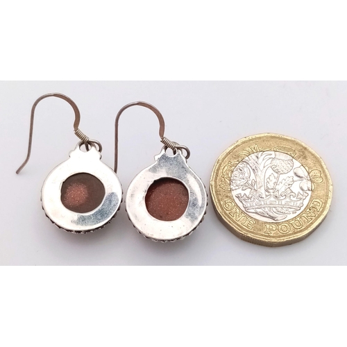 600 - A Pair of Sunstone Earrings Set in 925 Sterling silver. 14ct. W-7g. Comes with a presentation case. ... 