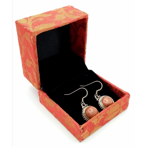 600 - A Pair of Sunstone Earrings Set in 925 Sterling silver. 14ct. W-7g. Comes with a presentation case. ... 